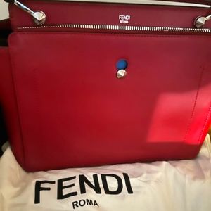 Red Fendi handbag with makeup bag